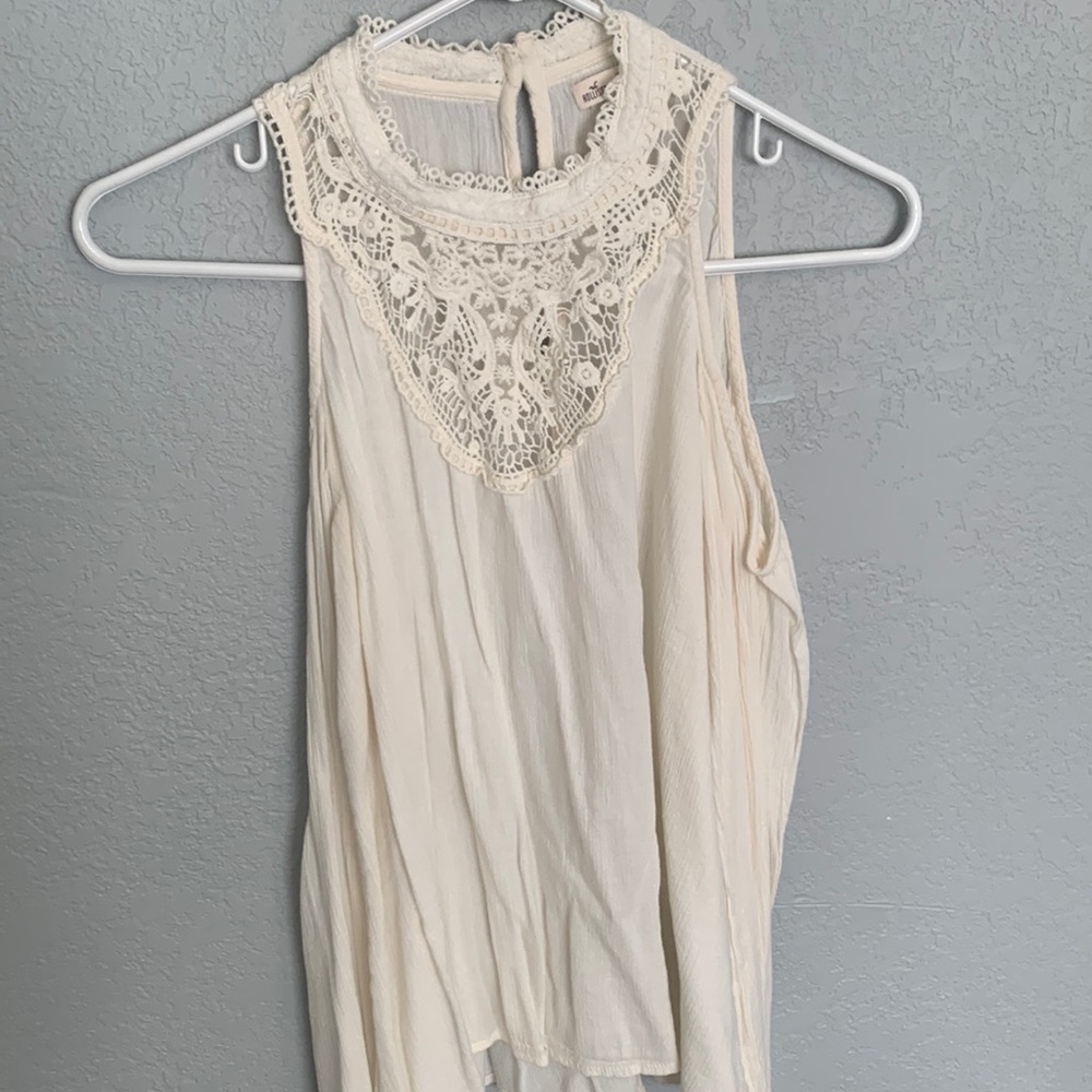 Brand: Hollister.     Cream/ white off the shoulder blouse